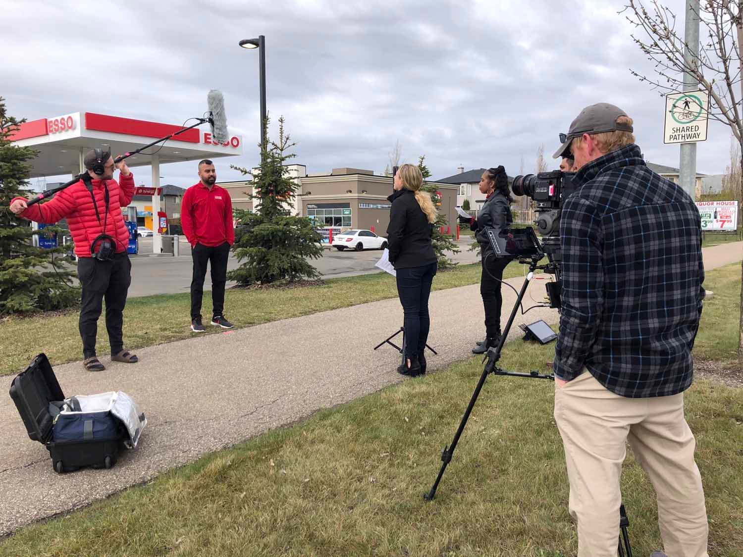 A video crew on location at a retail gas store.